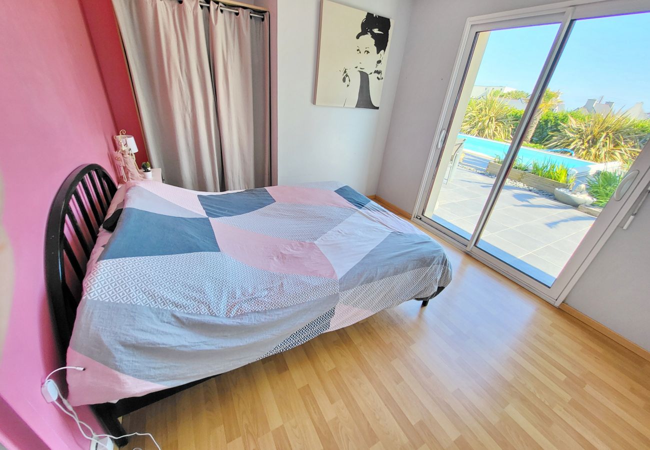 Bedroom 2 on ground level with direct access to the swimming pool